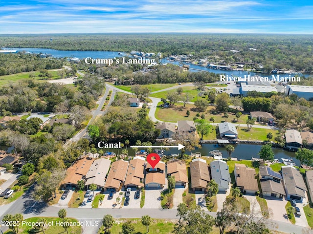 drone / aerial view with a water view and a residential view