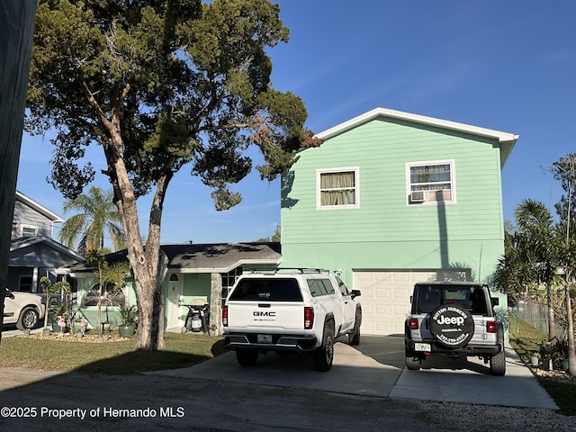 view of property exterior with driveway, an attached garage, and stucco siding