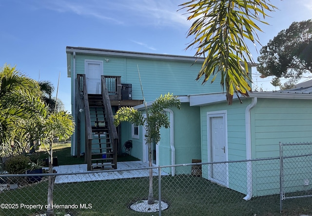 exterior space with fence and stairway