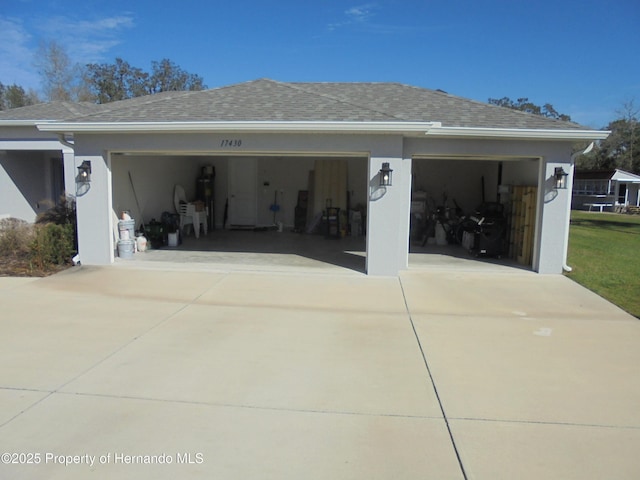 garage with concrete driveway