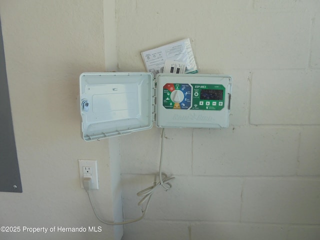 room details featuring concrete block wall