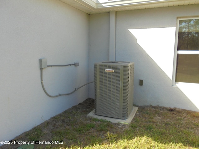 details with cooling unit and stucco siding