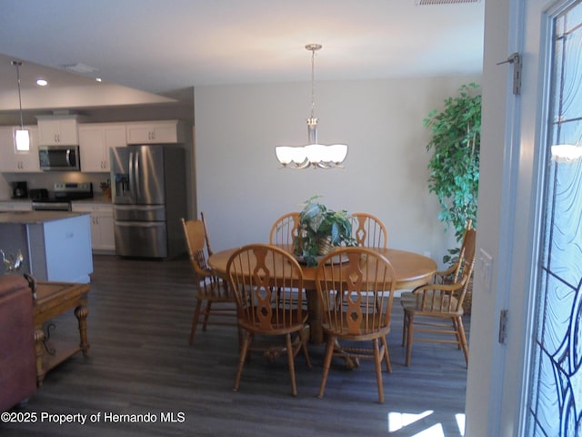 dining area featuring a chandelier, recessed lighting, dark wood-type flooring, and visible vents