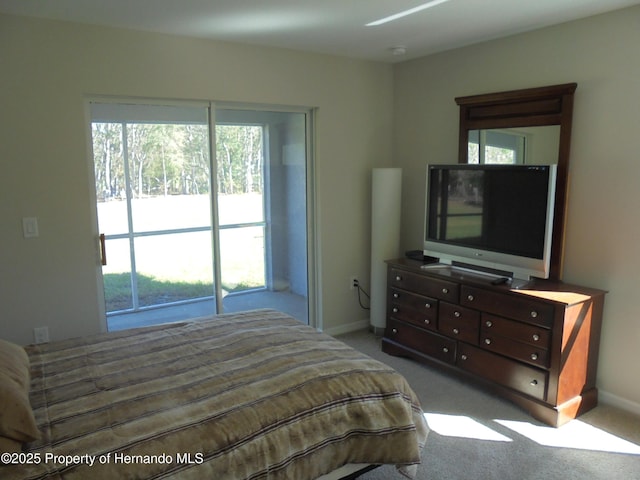 carpeted bedroom featuring baseboards