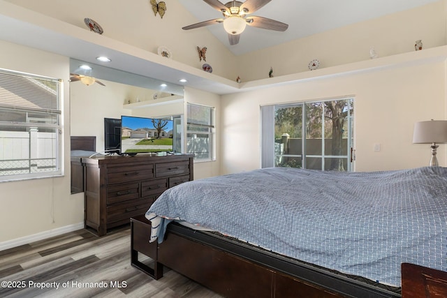 bedroom with recessed lighting, wood finished floors, baseboards, vaulted ceiling, and access to outside