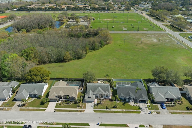 drone / aerial view featuring a water view and a residential view