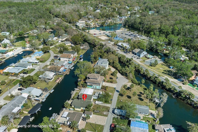 birds eye view of property with a water view and a residential view