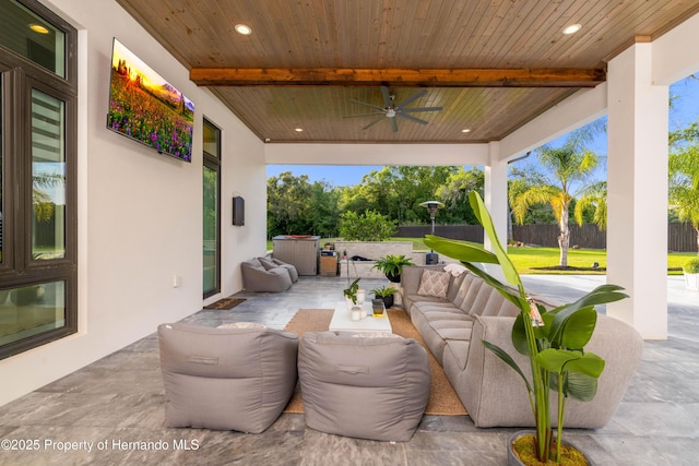 view of patio with ceiling fan, outdoor lounge area, and fence