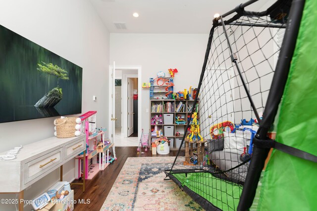 playroom featuring visible vents, dark wood-style flooring, and recessed lighting