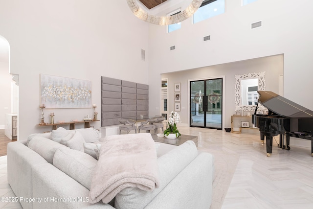 living room with visible vents and baseboards