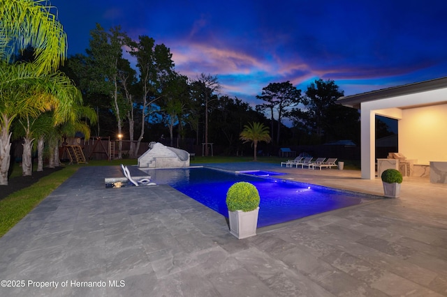 view of swimming pool featuring a patio, a fenced backyard, and a fenced in pool