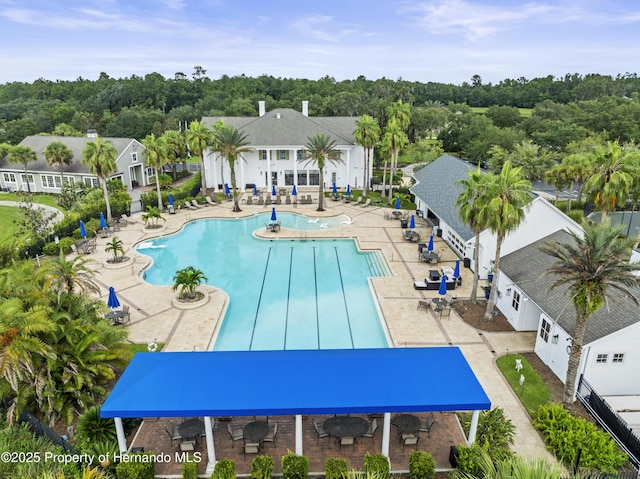 community pool featuring a patio area