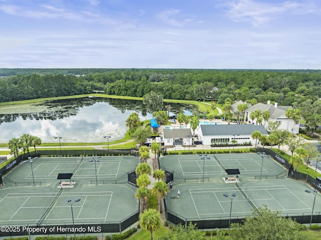 bird's eye view with a water view and a forest view