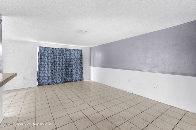 empty room with a textured ceiling