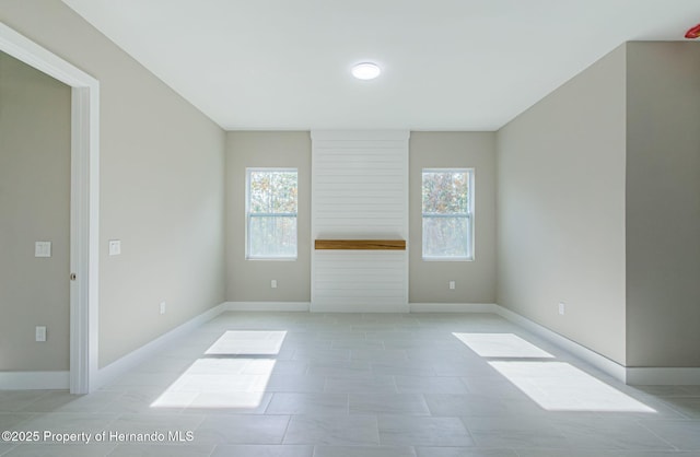 empty room featuring baseboards