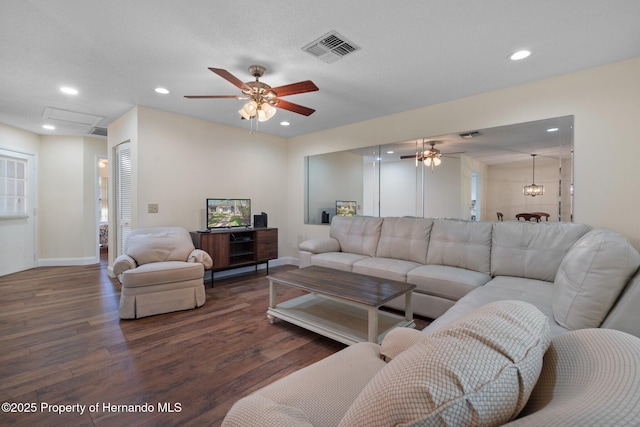 living room with a ceiling fan, visible vents, wood finished floors, and recessed lighting