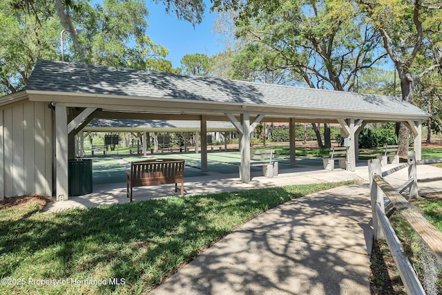 view of property's community with a lawn