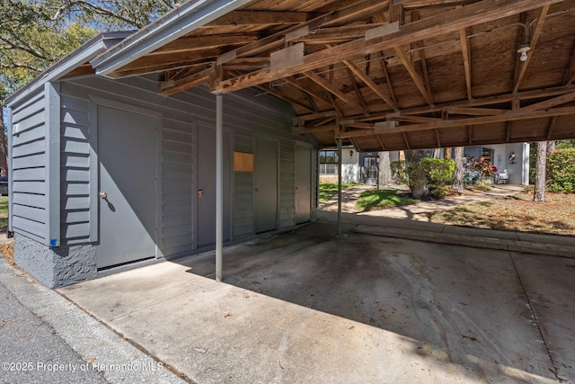 exterior space with a carport