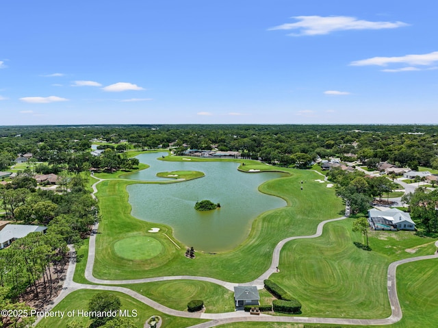 bird's eye view featuring a water view, view of golf course, and a view of trees