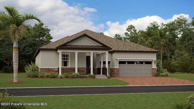 craftsman house featuring roof with shingles, stucco siding, a front yard, a garage, and stone siding