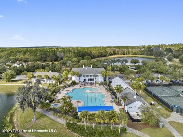 birds eye view of property with a water view