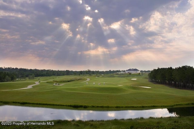 view of property's community with a water view and golf course view