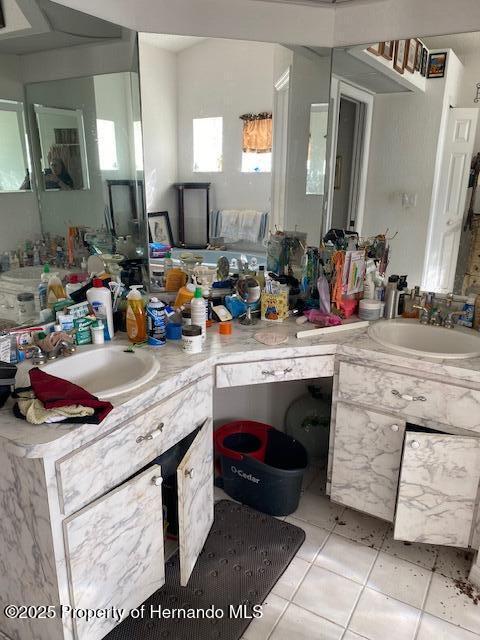 bathroom with vanity and tile patterned floors