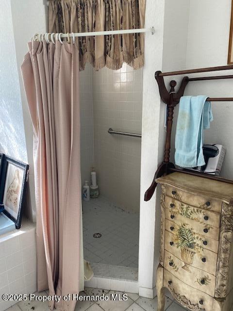 bathroom featuring a shower stall