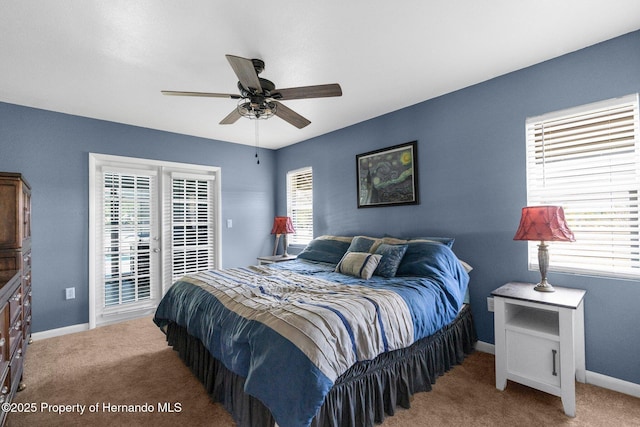13415 Ester Dr, Brooksville, FL 34613 - carpeted bedroom with baseboards, access to exterior, ceiling fan, and multiple windows