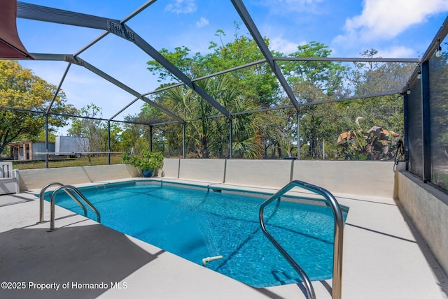 13415 Ester Dr, Brooksville, FL 34613 - pool featuring glass enclosure and a patio area