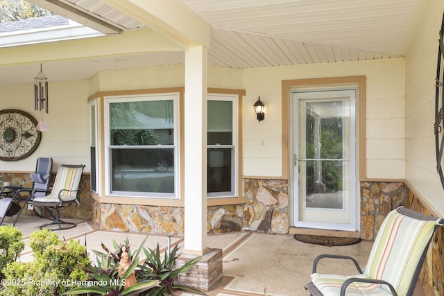 view of exterior entry with stone siding