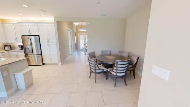 dining room with recessed lighting, visible vents, and baseboards