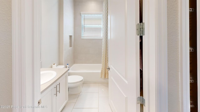 full bath featuring tile patterned flooring, shower / bath combination, vanity, and toilet