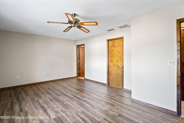 2013 Meredith Dr, Spring Hill, FL 34608 - empty room featuring wood finished floors, ceiling fan, baseboards, and a textured ceiling