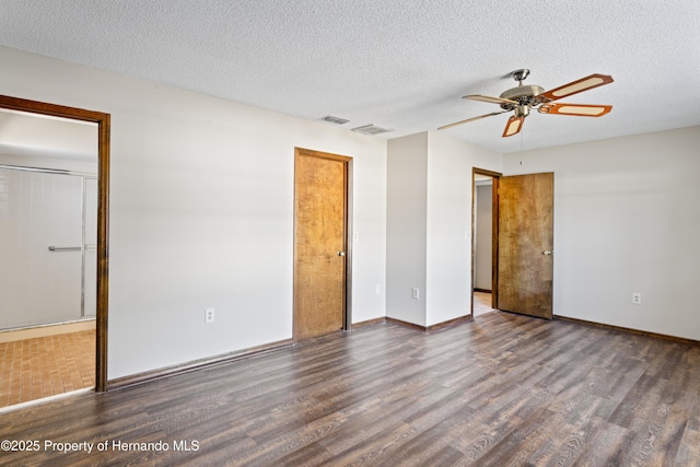 2013 Meredith Dr, Spring Hill, FL 34608 - unfurnished bedroom featuring wood finished floors, baseboards, a textured ceiling, and ceiling fan