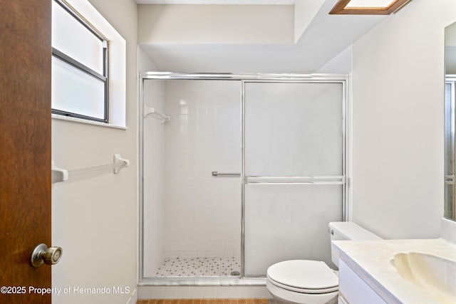 2013 Meredith Dr, Spring Hill, FL 34608 - full bath featuring a stall shower, vanity, and toilet