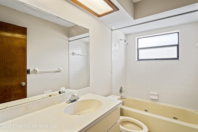 2013 Meredith Dr, Spring Hill, FL 34608 - bathroom featuring bathing tub / shower combination, vanity, and toilet