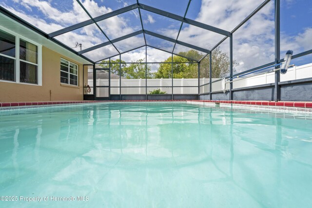 2013 Meredith Dr, Spring Hill, FL 34608 - view of swimming pool with a lanai and fence