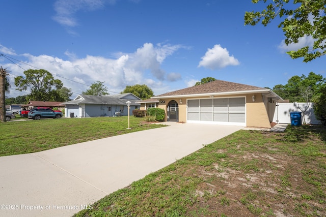 2013 Meredith Dr, Spring Hill, FL 34608 - single story home featuring stucco siding, concrete driveway, and an attached garage
