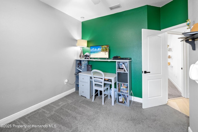 home office featuring visible vents, baseboards, and carpet flooring