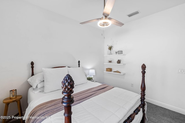 bedroom featuring baseboards, visible vents, a ceiling fan, and carpet