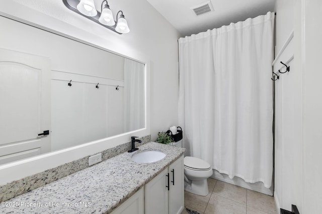 bathroom with tile patterned floors, visible vents, toilet, shower / bath combo, and vanity