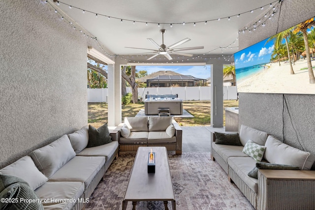 view of patio with an outdoor living space, a fenced backyard, and ceiling fan