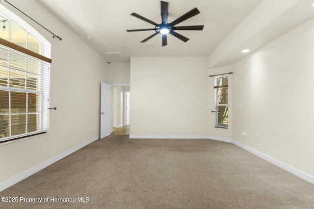 empty room with carpet, ceiling fan, baseboards, and recessed lighting