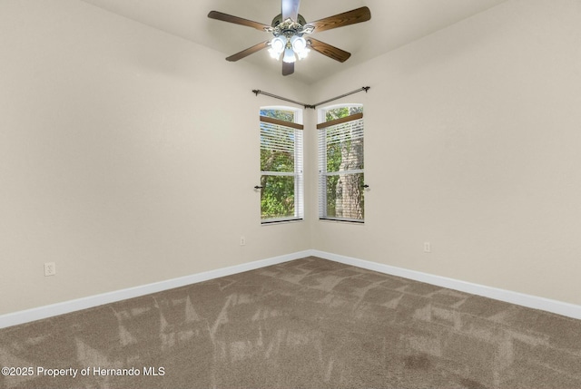 unfurnished room with carpet floors, ceiling fan, and baseboards