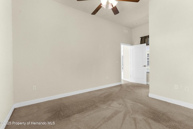 unfurnished room featuring carpet flooring and baseboards