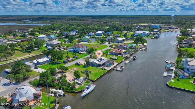 birds eye view of property with a residential view and a water view