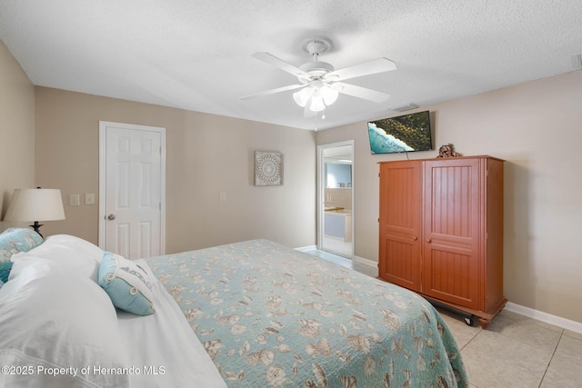 bedroom with light tile patterned floors, visible vents, ceiling fan, a textured ceiling, and baseboards