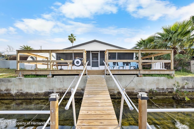 view of dock featuring a water view and boat lift