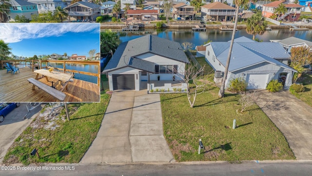 aerial view with a residential view and a water view